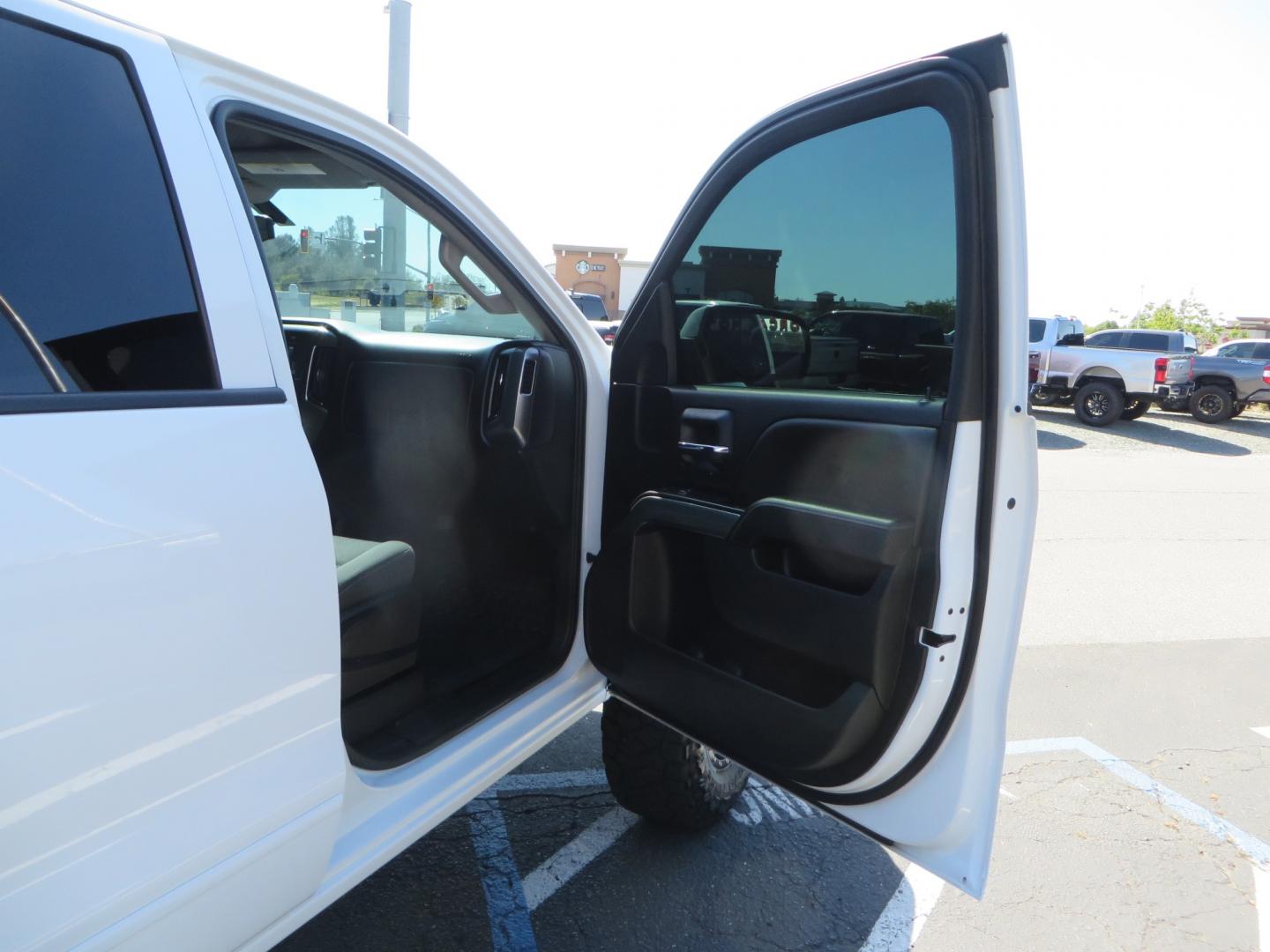 2018 White /BLACK Chevrolet Silverado 1500 LT (3GCPCREC7JG) with an 5.3L V8 OHV 16V engine, automatic transmission, located at 2630 Grass Valley Highway, Auburn, CA, 95603, (530) 508-5100, 38.937893, -121.095482 - Must see Pre Runner.... CST front lift spindals, Camburg UCA's, King Adjustable 2.5 Coil-overs, King 2.5 rear shocks, 35" Toyo RT Trail tires, 17" Method Race wheels, MZ front skid plate, G2 rear differntail cover, Full size bed mounted spare tire, Black Vinyl roof wrap, smoke tail lights and 3rd br - Photo#45